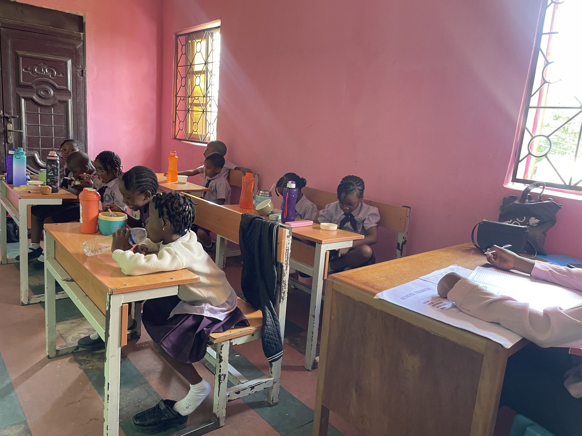 Pupils having a snack together in their classroom at Royal Excellentia International School
