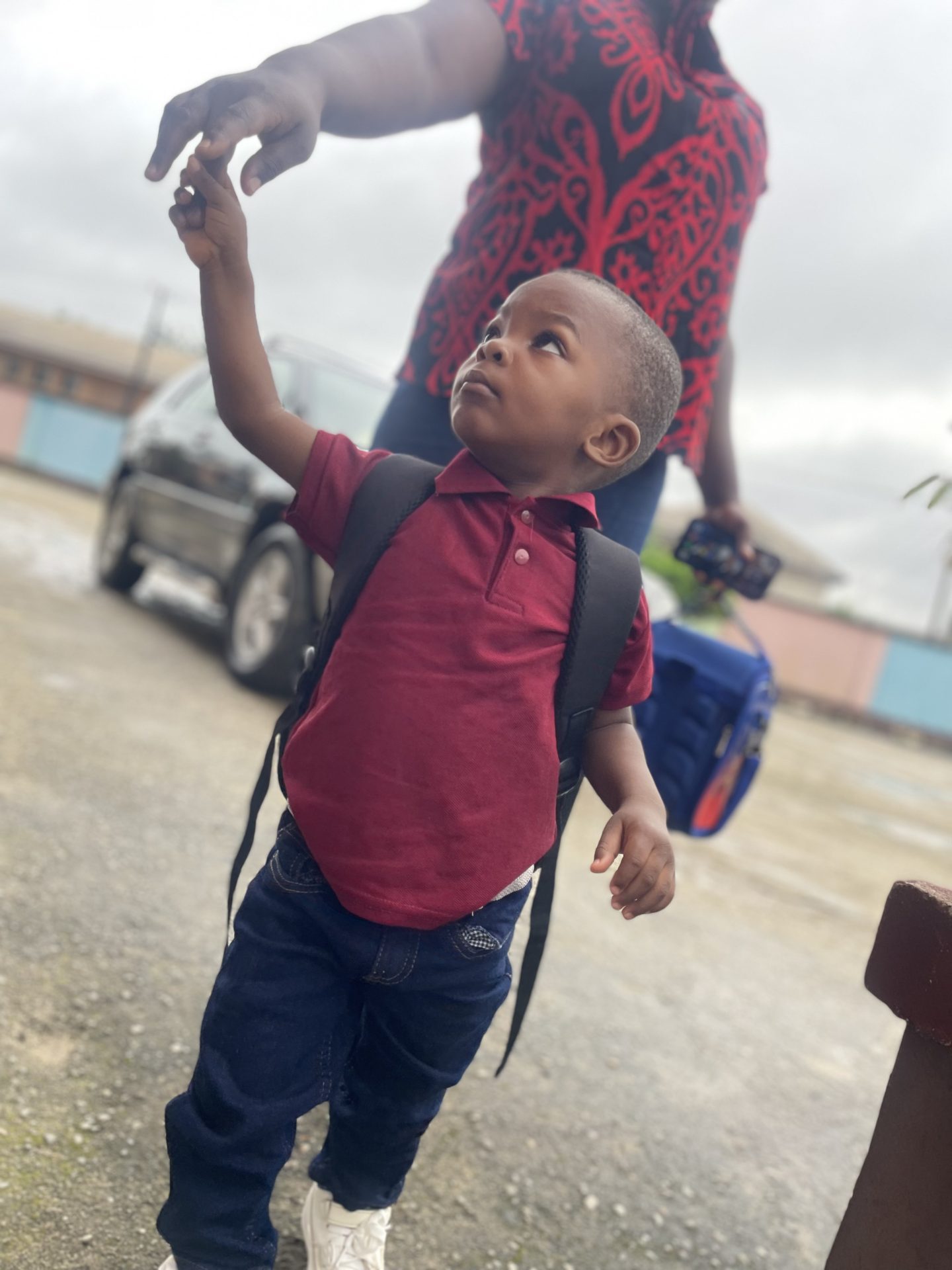 A young pupil arriving for the school day at Royal Excellentia International School